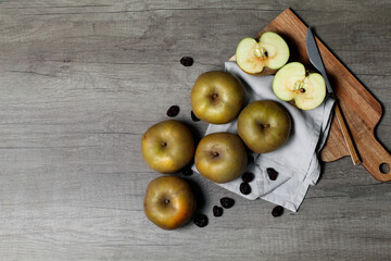 Pipping apples for compote on wooden board
