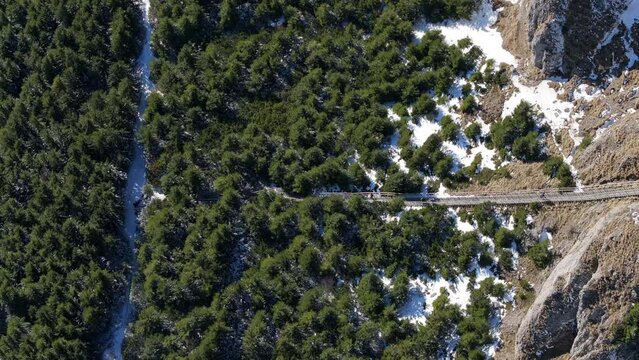 Aerial drone view of Toaca Peak stairs in winter season. Ceahlatu Massif National Park, Romania