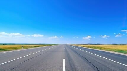 Naklejka premium highway in the grassland background of blue sky and bright clouds, long road stretches into the distance. empty street on a beautiful sunny day