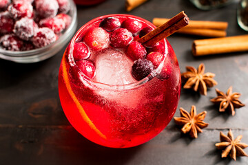 Spiced Cranberry Bourbon Old Fashioned with Sugared Cranberries: Red Christmas holiday-themed...
