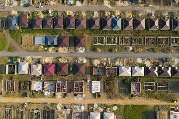 Construction of a suburban neighborhood of cottages. Aerial view.
