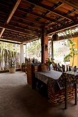 interior of restaurant, table and chairs in the farm house, table and chairs on the terrace, table...