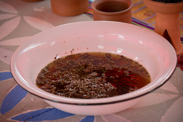 a bowl of tea, traditional thai ceremony, cocoa ritaul, kundalini awakening, religious ritual,  tea preparation, tea in the bowl