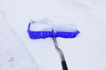 Shoveling snow from the driveway: shovel in the snow