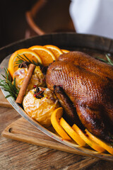 Christmas dinner. Roast duck with apples, oranges and cranberry sauce