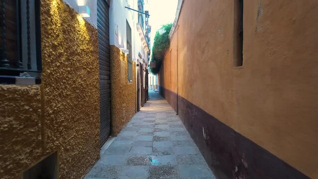 Walking through the narrow streets of the Santa Cruz neighborhood also known as the Juderia or Jewish quarter of Seville.