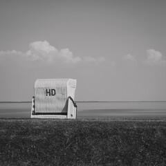 A picture of the Büsum dyke with a beach chair.