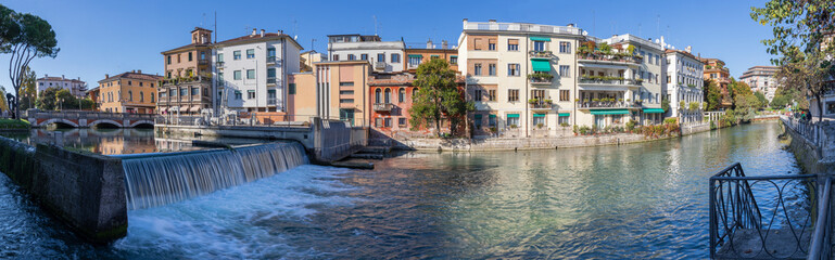 Fototapeta na wymiar Treviso - The panorama of the old town with the Sile river.