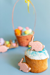 Easter still life with two pink gingerbread in the form of a rabbit on an Easter cake