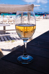 Glass of Pink or Rose Wine on a Table of a Beach Restaurant