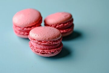 Fototapeta premium Pink Macaroons on Blue: A Concept of Growth and Classification