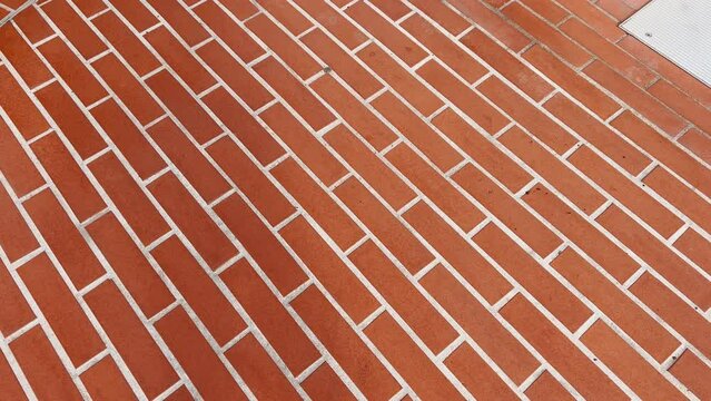 Walking on a bricked paved path pov moving perspective