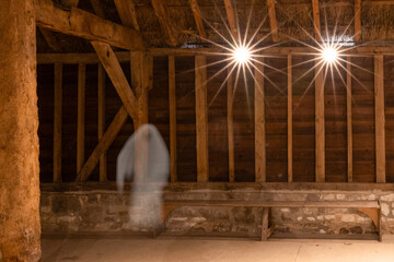 Ghostly figure in an historic tithe barn.