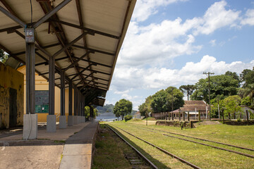 Castro Paraná Brazil Abandoned train station in the city of Castro on a sunny day with a view of the train tracks - obrazy, fototapety, plakaty