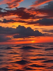 Obraz premium red sunset on the sea, shoreline red sky, waves