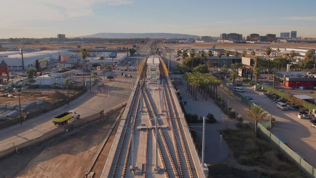 Aerial view of LAX south runway and transit line at sunrise