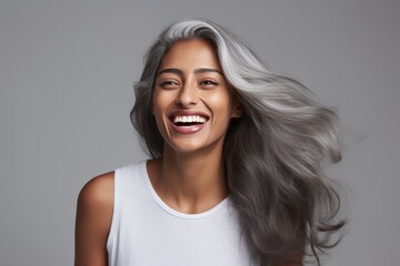 beautiful dark skin Indian women with smooth butter-like glowing skin and her long grey hair is bouncing 