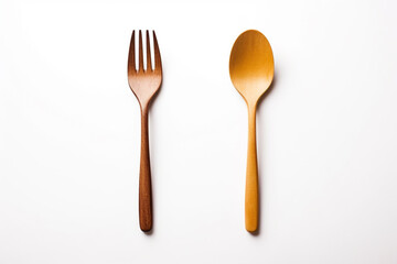 a wooden fork and spoon on white background