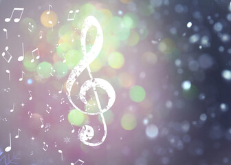 Treble clef, music notes and snowflakes against blurred background, space for text. Bokeh effect