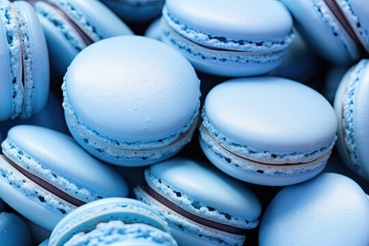 Close up background of traditional French blue macarons with assorted fillings