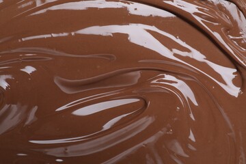 Tasty chocolate paste as background, closeup view