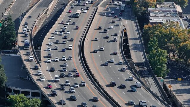 Aerial view of the highway and crossroads intersections in Phoenix, USA. Top up aerial drone view of elevated road and traffic junctions.