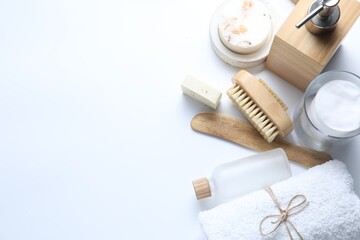 Bath accessories. Flat lay composition with personal care products on white background, space for text