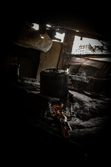 pan on wood stove,mud house kitchen, mud house interior, mud house, social inequality, misery, poverty, Brazil, calamity

