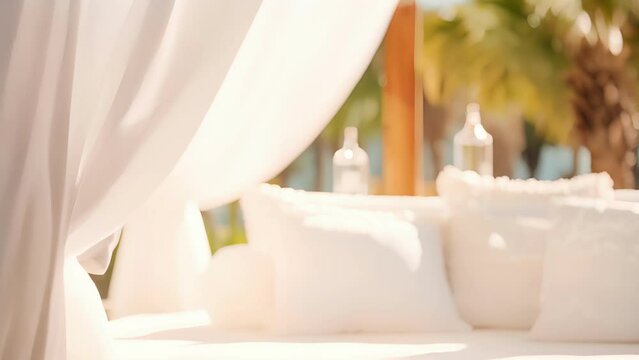 Closeup of the crisp white linens covering the daybed in the cabana, inviting guests to relax and enjoy the luxurious surroundings.