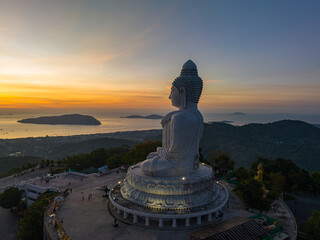.aerial view scenery yellow sky glare of sun above Phuket big Buddha.Phuket Big Buddha is one of...