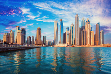 Dubai - The skyline of Downtown. Dubai city - amazing city center skyline and famous Jumeirah beach at sunset, United Arab Emirates
