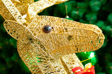 a gold color reindeers head at horizontal composition