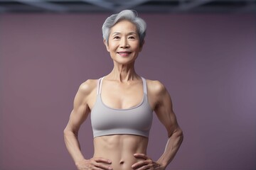 体を鍛えている日本人シニア女性（背景あり・筋トレ・筋肉・フィットネス・ヘルスケア） 