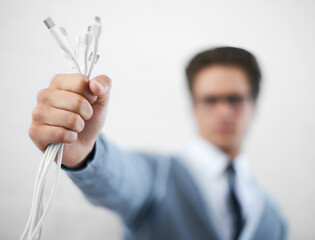Man, cables plug and businessman in fashion, hand and electrician for connection, professional and...