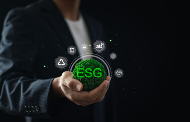 ESG environmental, social and governance. Businessman holding green globe with global ESG icons  for world sustainable environment concept.