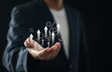 Interest rate and dividend concept, Businessman holding up arrow symbol and percentage symbol for...