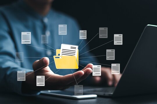 Document management system (DMS) technology, Businessman using laptop with database folder online to store files document data digital. file storage process with security.