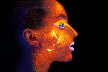 Art, woman and profile with neon paint on face and beauty, bright lipstick and creative skincare on...
