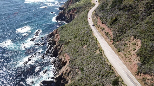 Drone aerial photo of the California coastline with cliffs and rocky beach side coastline on PCH 1