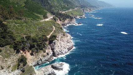 Drone aerial photo of the California coastline with cliffs and rocky beach side coastline