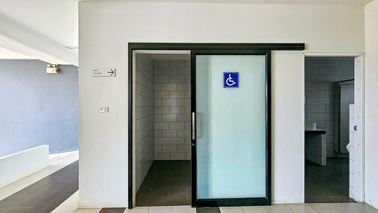 Toilet entrance sign for the disabled, Toilet for the elderly. Toilet aluminum alloy Sliding Glass Doors. Symbol showing toilet for elderly and disabled in the public. - obrazy, fototapety, plakaty