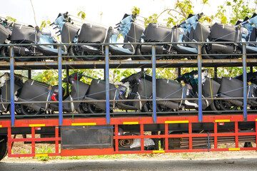 Trailer truck that transports many new motorbikes coming from the motorbike factory to be delivered...