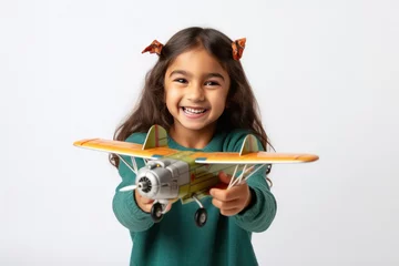 Cercles muraux Ancien avion cute little girl holding air plane on white background