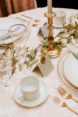 Elegant gold & white dinner table place settings