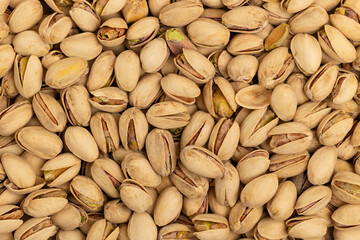 Top view of pistachios layered as a background