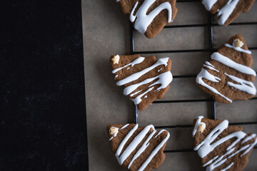 Overhead view of gingerbread cookies on baking rack.