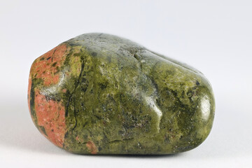 Unakite is an metamorphic rock that is altered granite composed of pink orthoclase feldspar, green epidote, and generally colorless quartz.