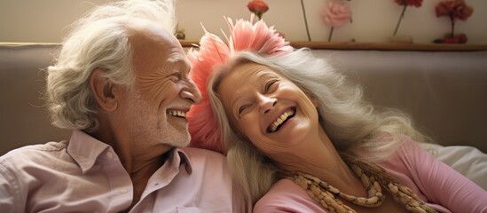 Elderly couple enjoying humorous and playful moments together while on vacation or relaxing in a bedroom.