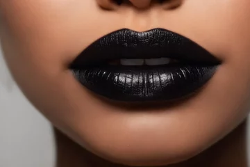 Close-up of beautiful lips with black lipstick © Giuseppe Cammino