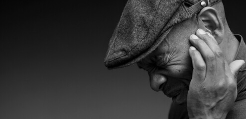 deafness suffering from hearing loss on grey black background with people stock image stock photo	